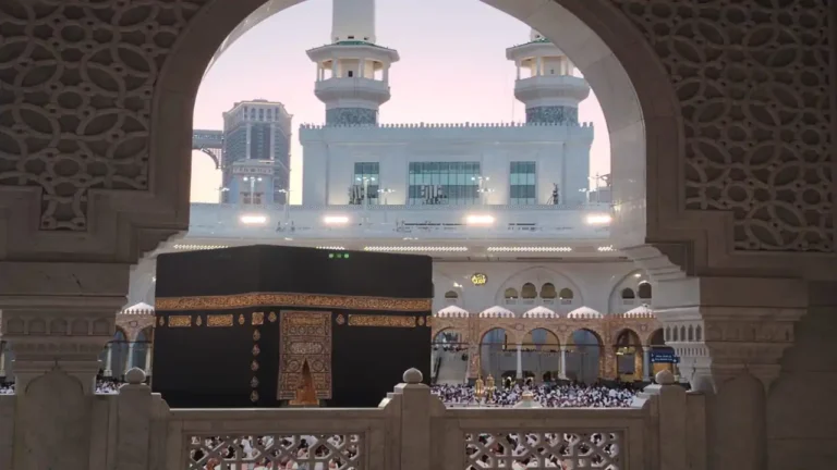 Pilgrims in Ihram worshiping at the Kaaba during Hajj