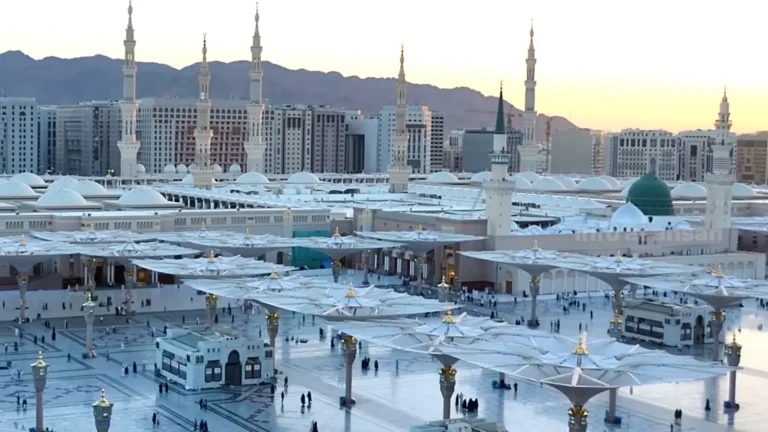 Medina Travel Guide 2025 showing Masjid an-Nabawi with Green Dome and pilgrims walking in peace
